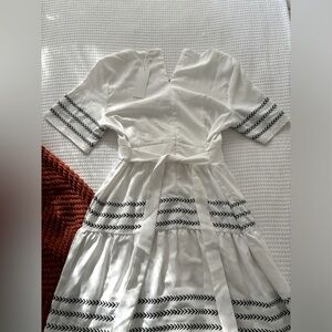 White peasant dress with black embroidery. Size M. Brand new - tag still on